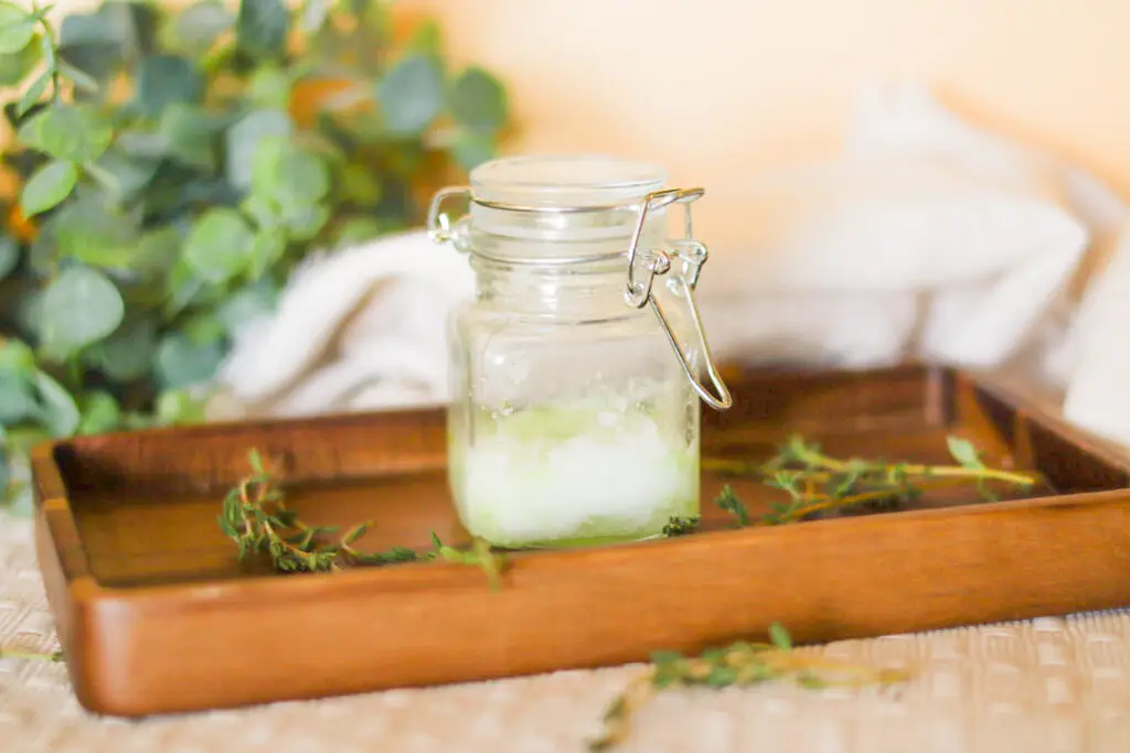 glass airtight jar holding scalp exfoliation for body care