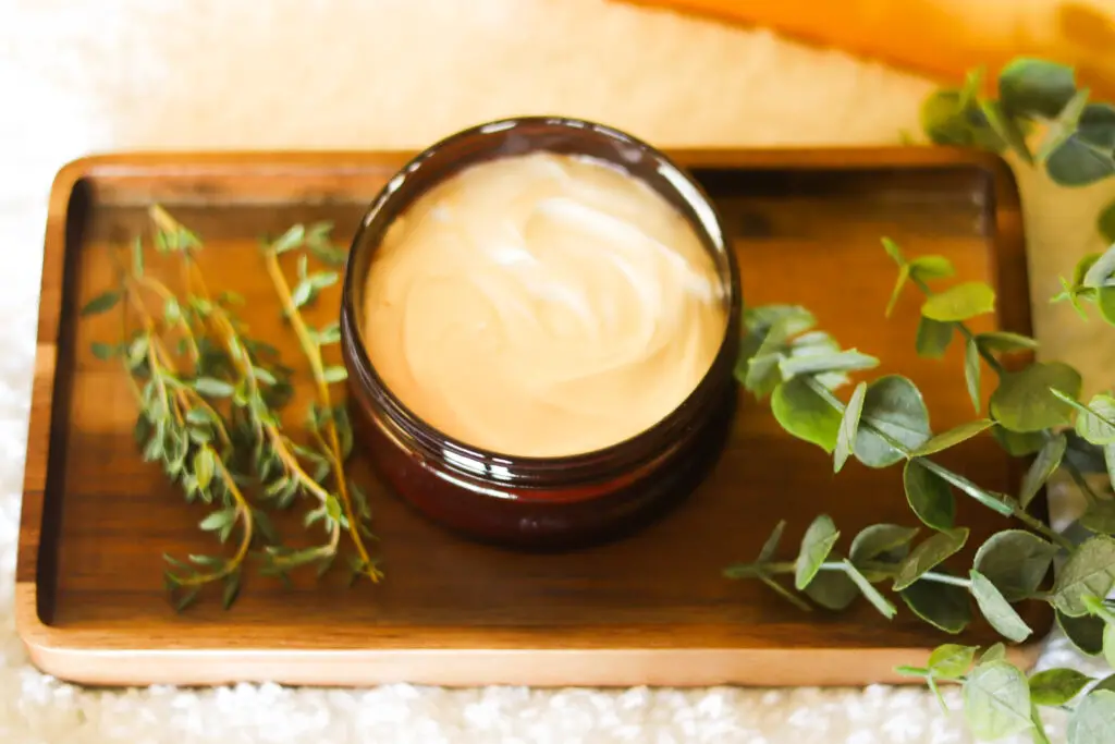 Body cream inside of a brown container 