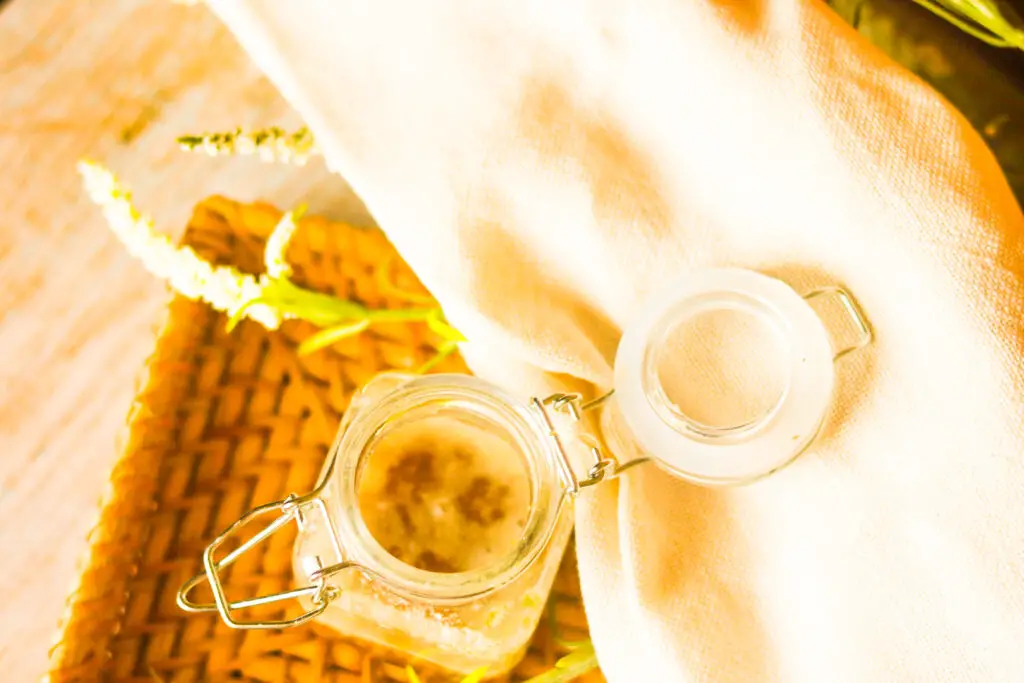 facial scrub in glass container with the lid