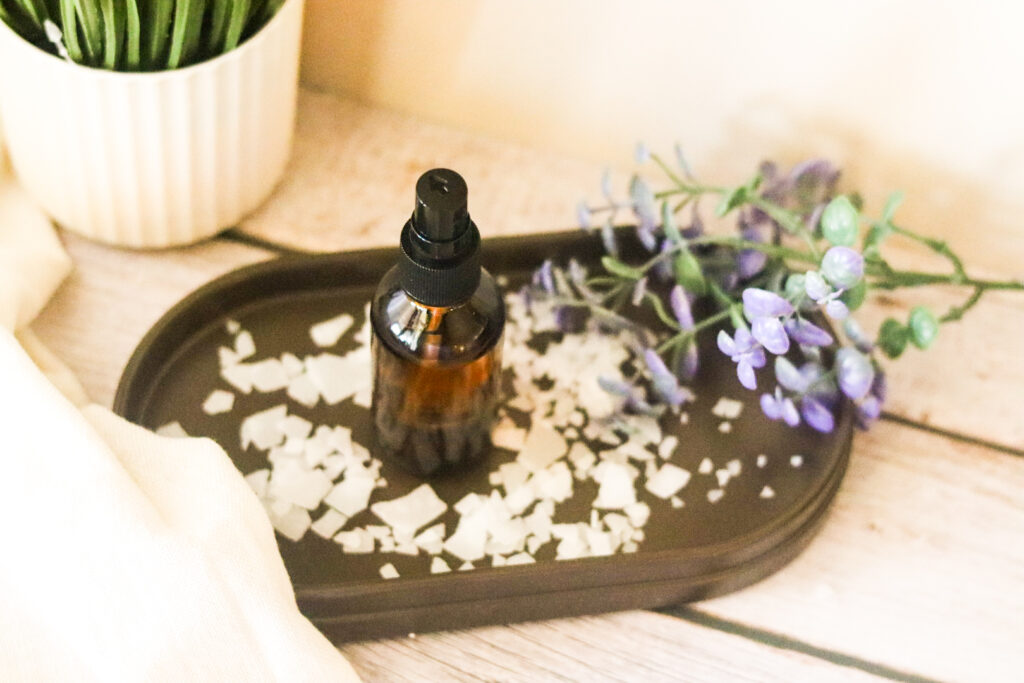 magnesium spray for feet in amber bottle on brown tray