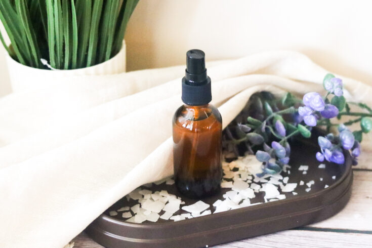 magnesium spray for feet with magnesium flakes and a cloth & flower