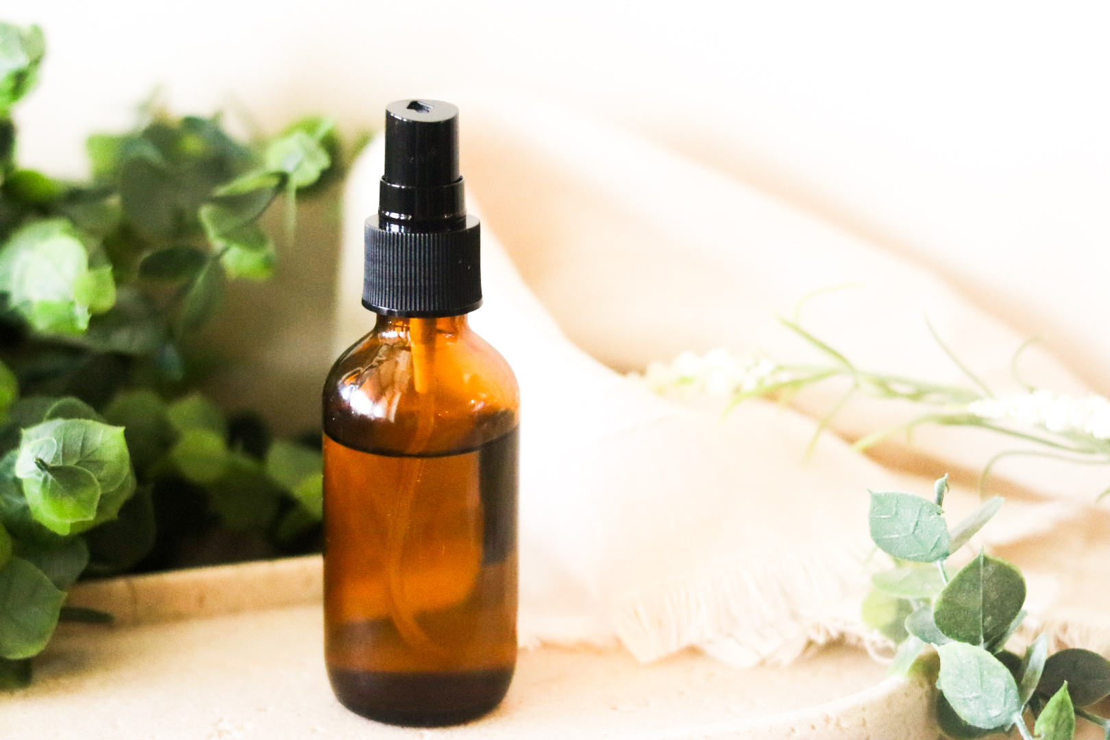 pillow case spray on stone plaque with green plants