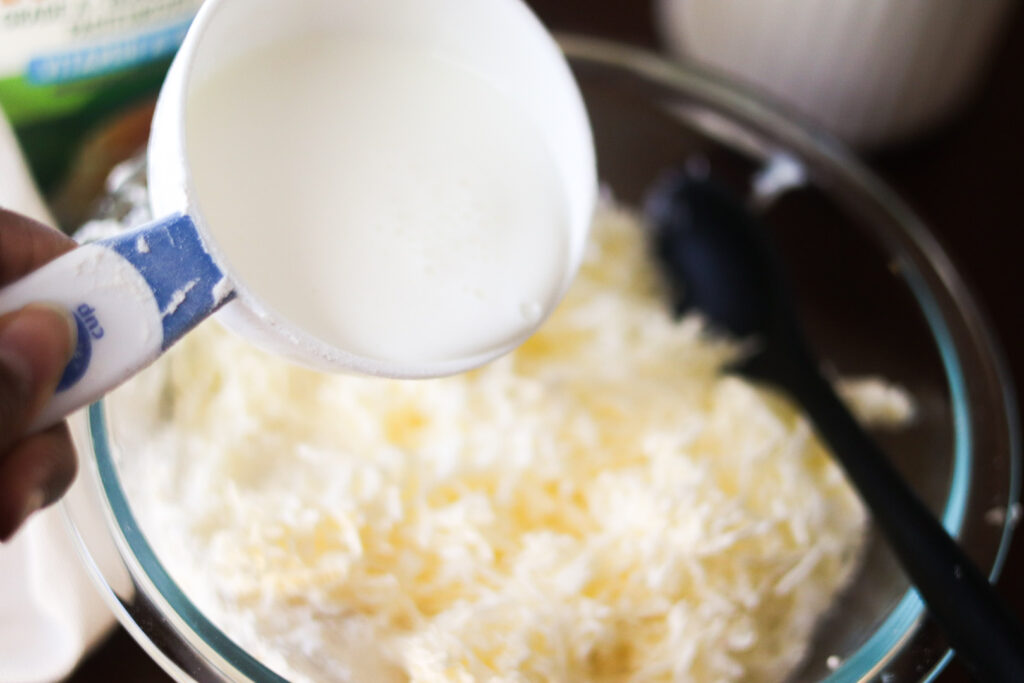 pouring milk into dry ingredients