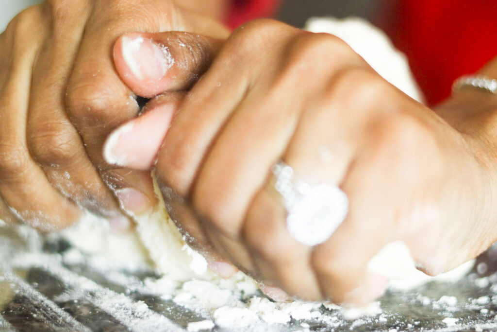 gently kneeding easy homemade biscuits dough