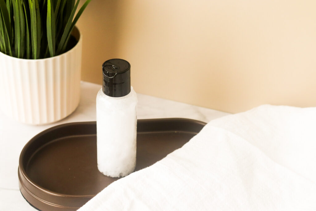 toilet bowl deodorizer on brown tray next to linen cloth top
