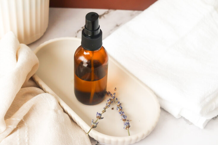 Toilet Bowl Air Freshener on white tray next to lavender and white cloth