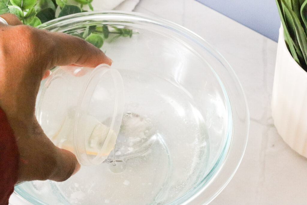 stirring in apple cider vinger into natural mouth rinse