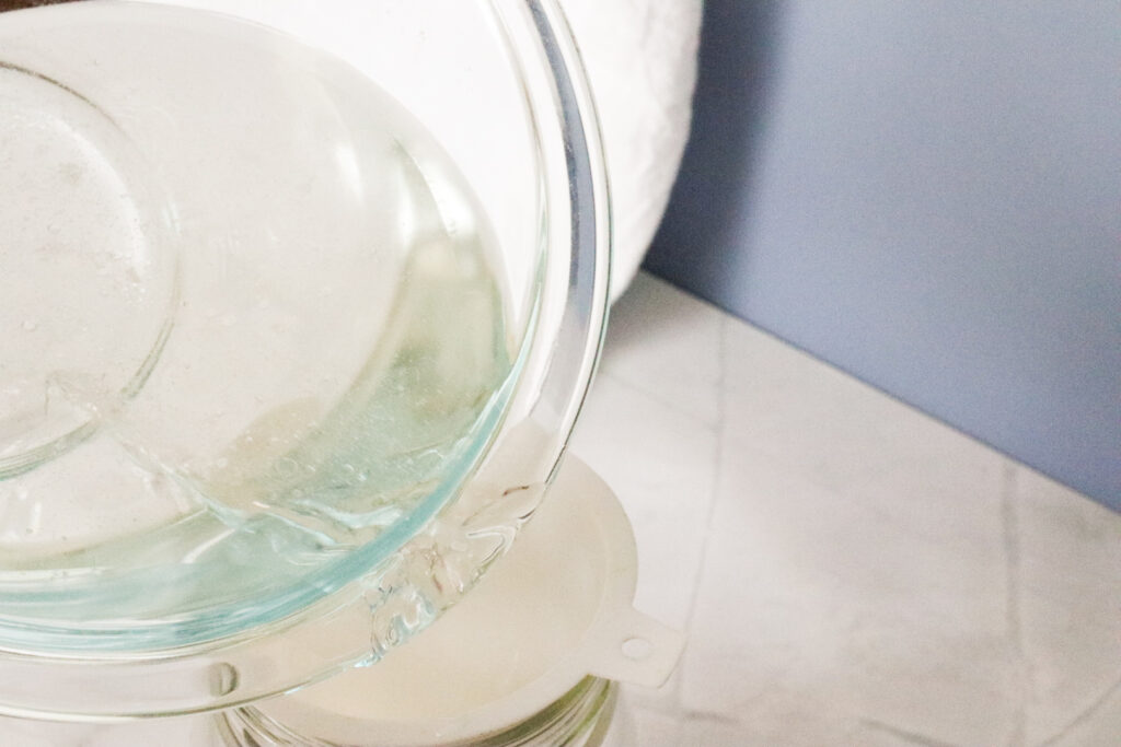 transferring natural mouth rinse ingredients to glass mason jar