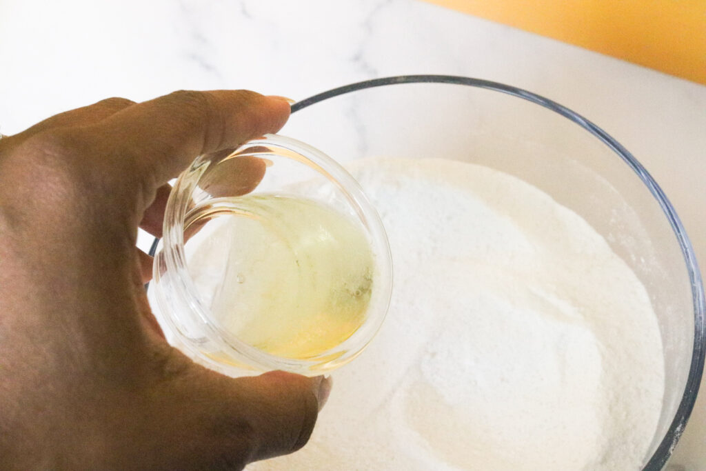 mixing liquid into dry ingredients for toilet bowl bombs