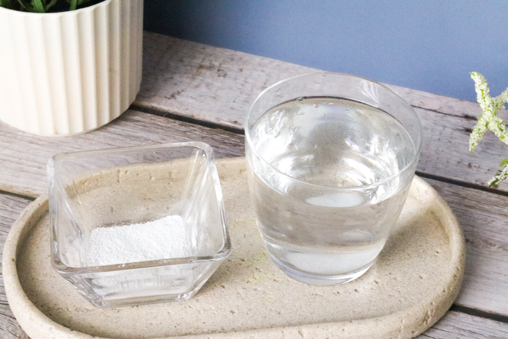 Magnesium Powder on tray next to a warm cup of water